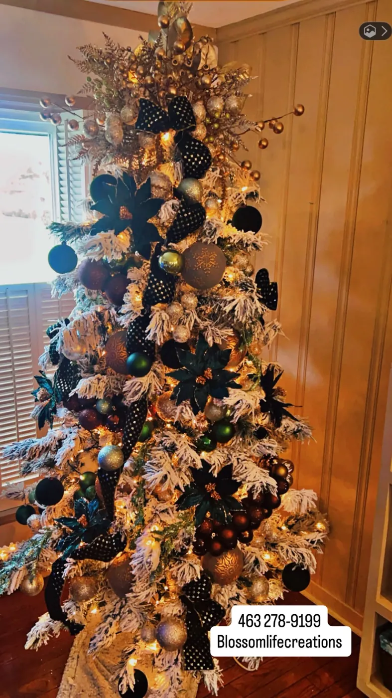 Holiday centerpiece with candles, copper ribbon, and berries