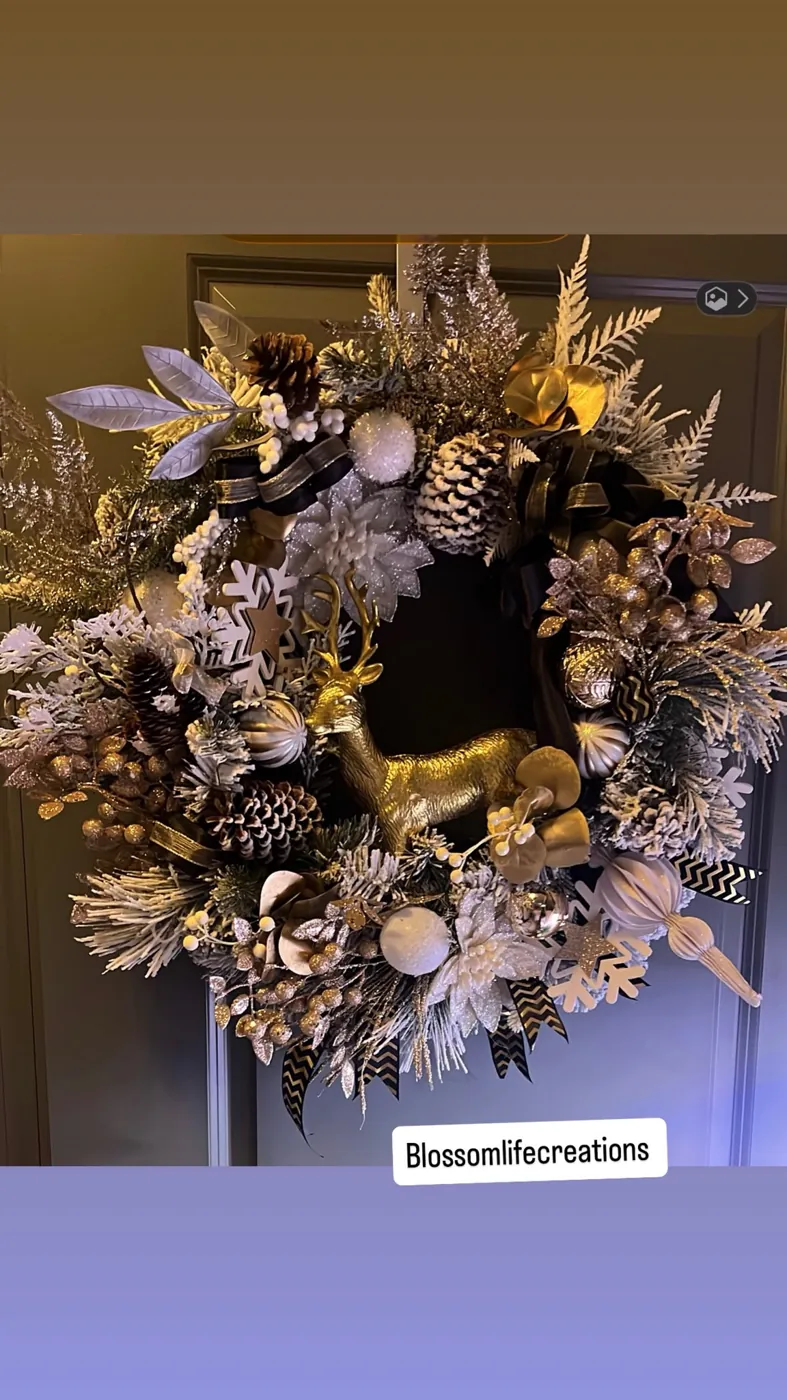 Red and gold Christmas decor with greenery and ornaments