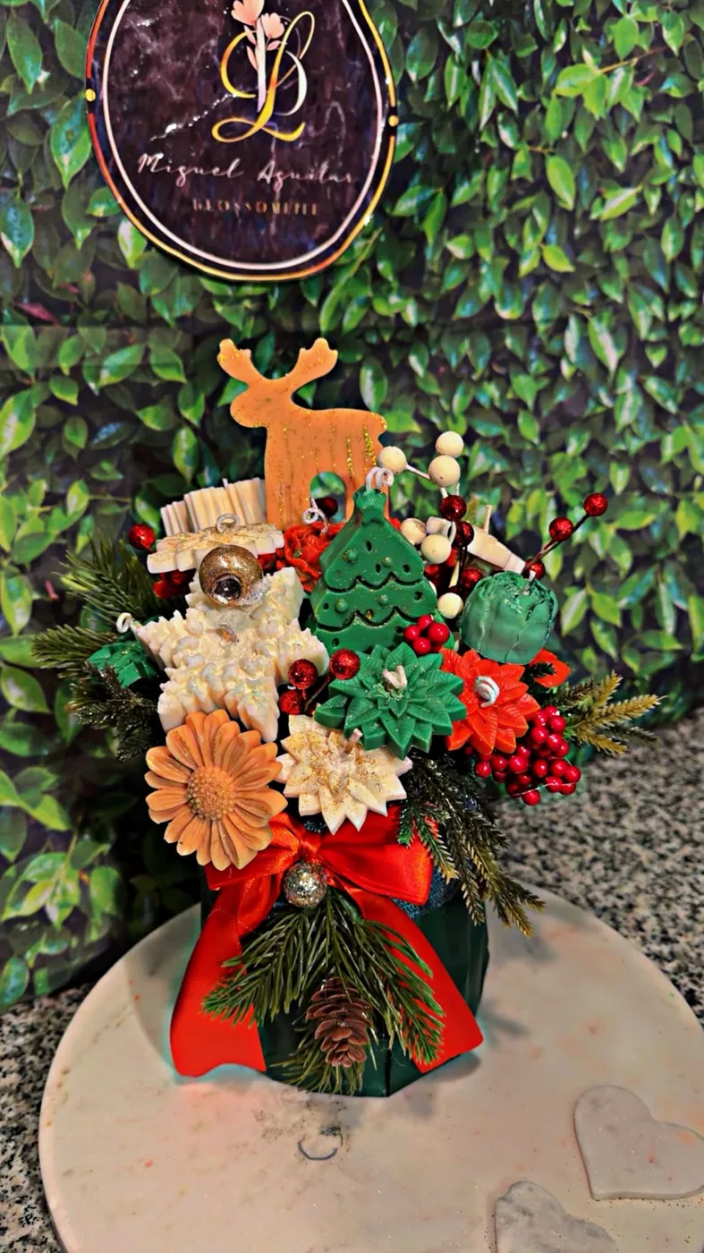 Christmas floral arrangement with red blooms and pinecones