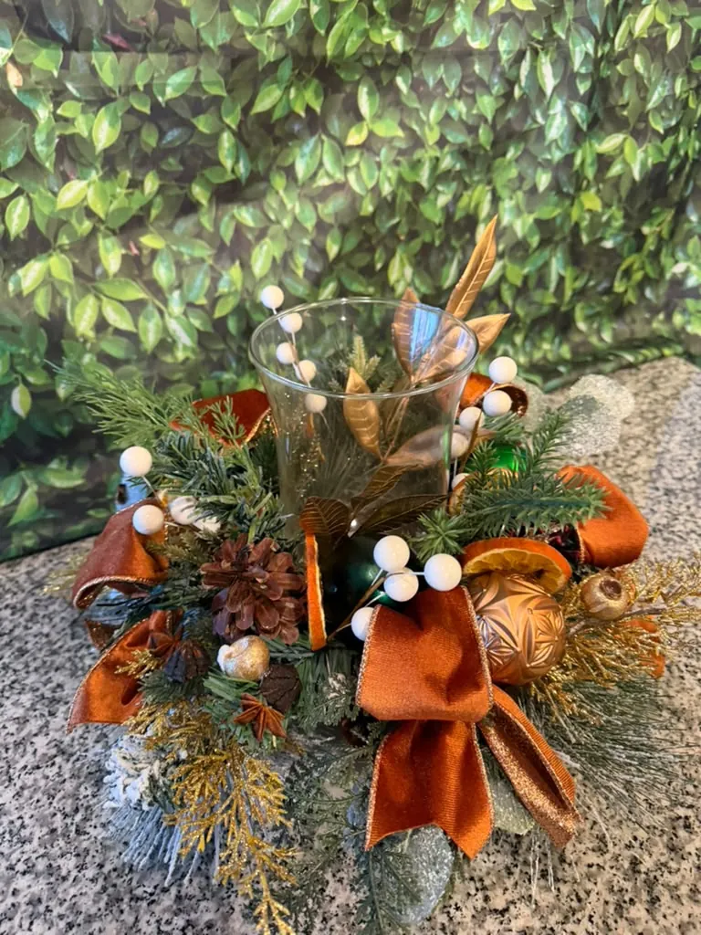 Blooming pumpkin arrangement with autumn stems and berries